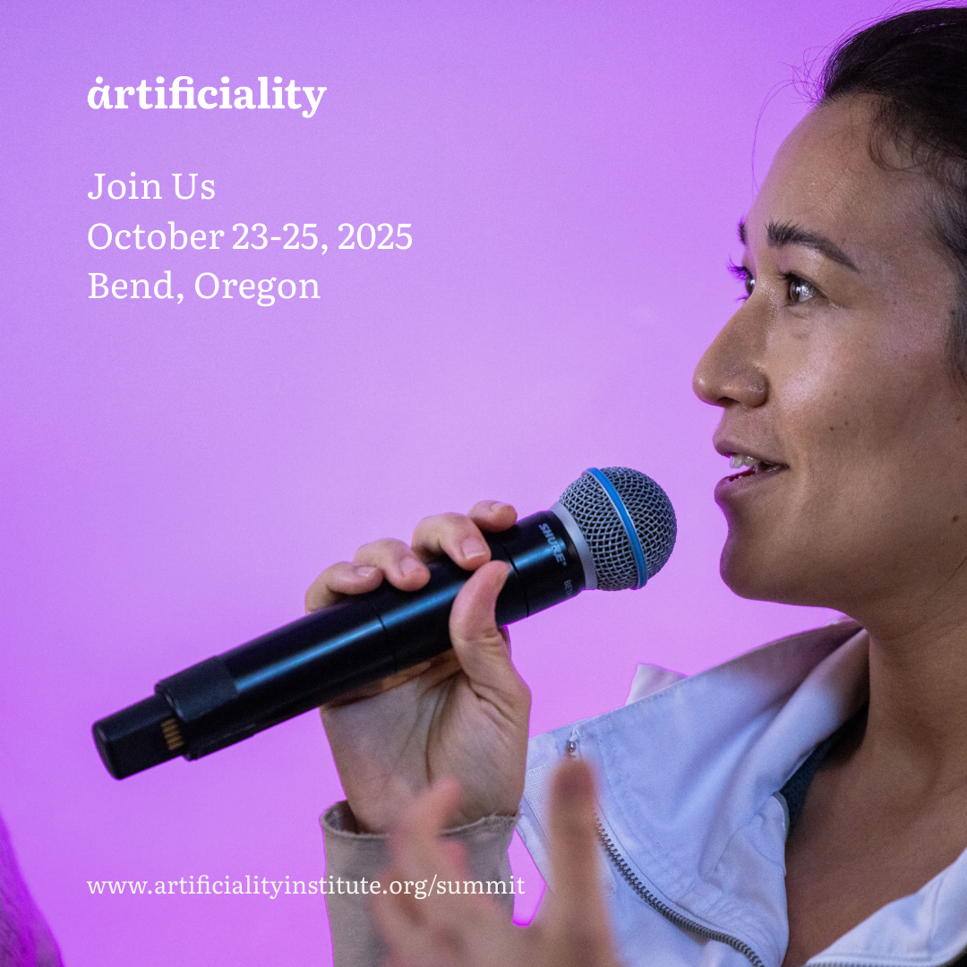 Engaged audience member asking a question at the Artificiality Summit