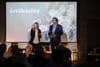 A photo of Helen and Dave Edwards speaking at the Artificiality Summi